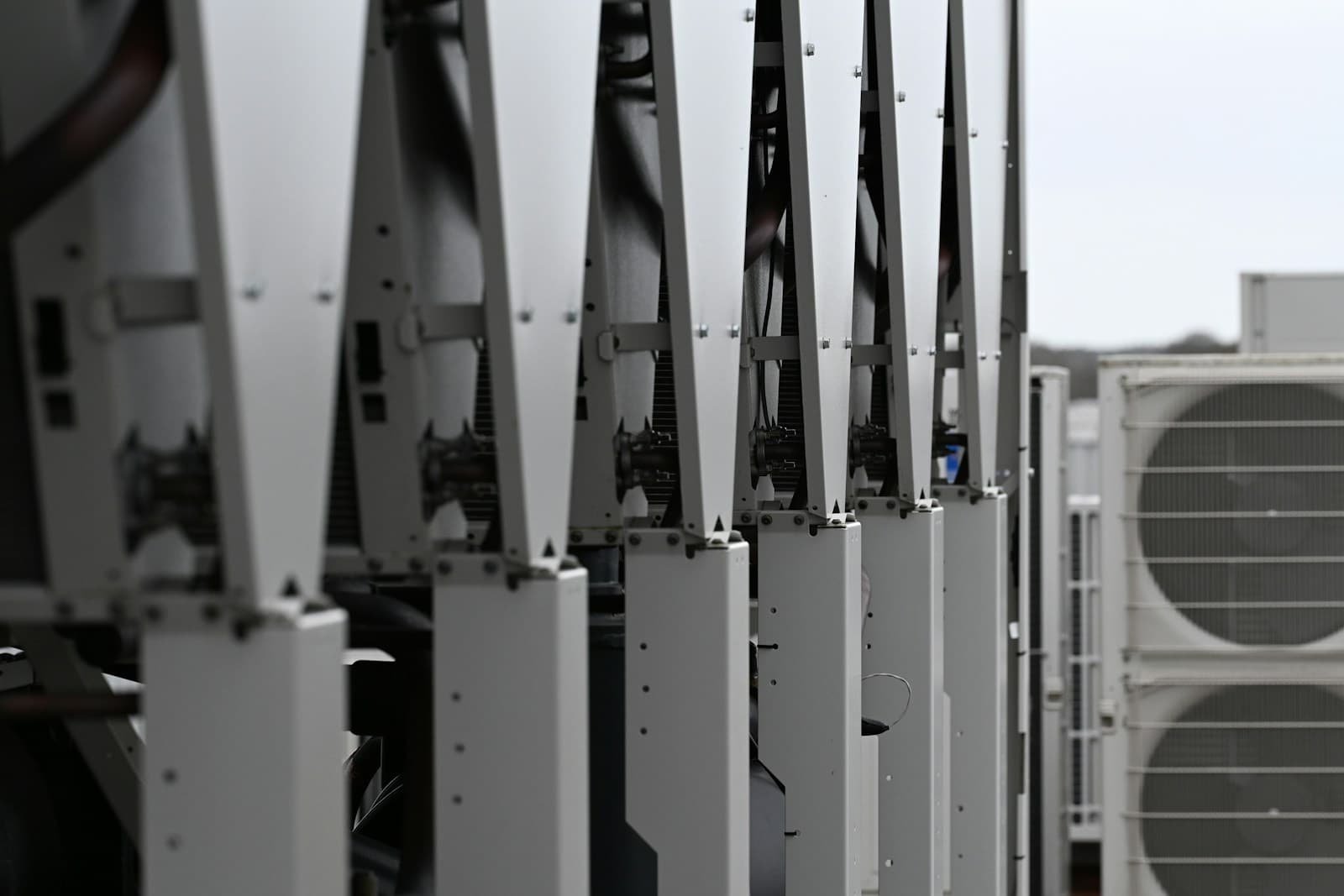 Row of white rooftop HVAC chillers