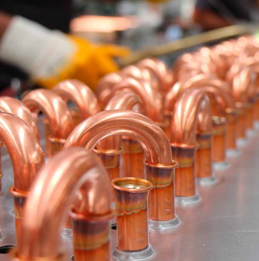 Copper return bends on a heat exchanger assembly